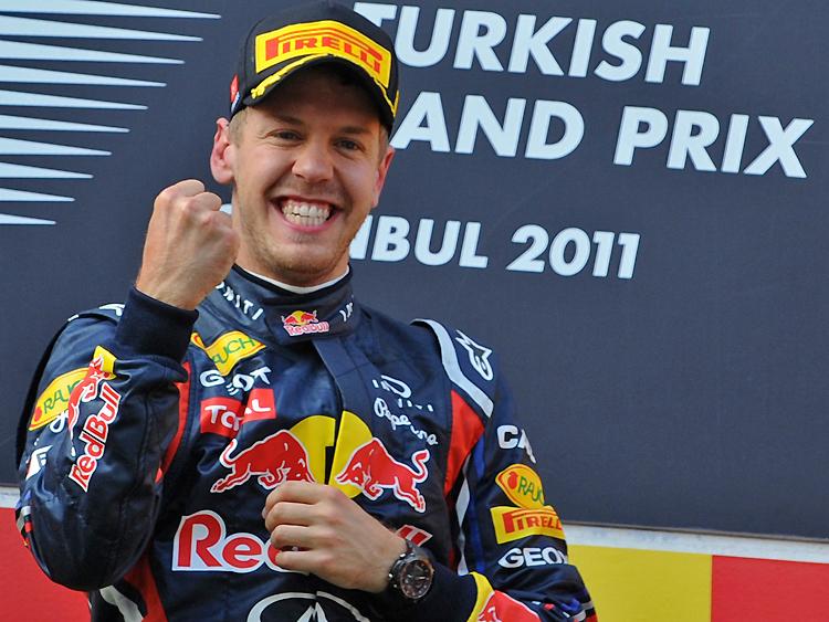 DOMINATING DRIVE: Sebastian Vettel celebrates on the podium at Istanbul Park after winning the Formula One Turkish Grand Prix on Sunday. (Bulent Kilic/AFP/Getty Images)
