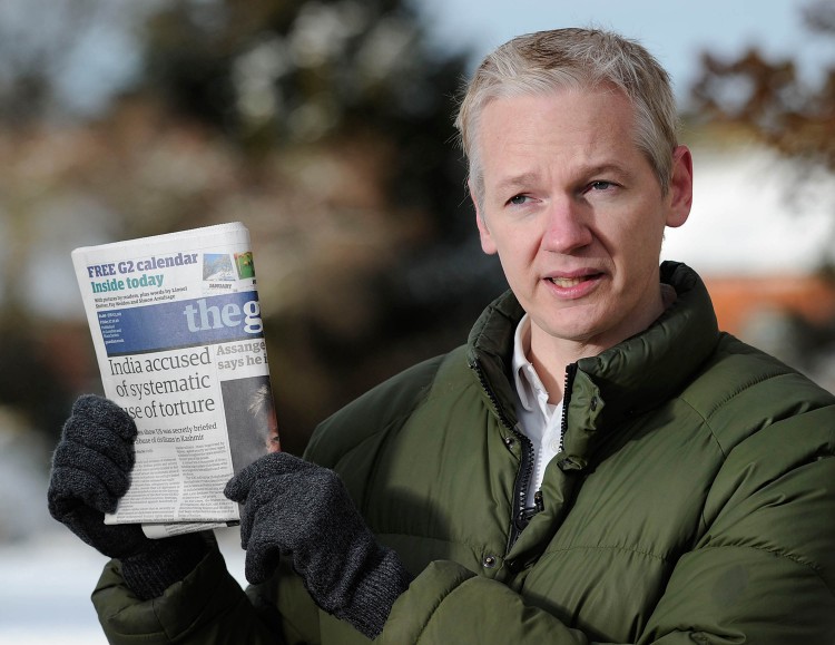 PARTING ALLIES: WikiLeaks founder Julian Assange holds up a copy of Britain's Guardian newspaper on Dec. 17, 2010. (Carl Court/AFP/Getty Images) PARTING ALLIES: WikiLeaks founder Julian Assange holds up a copy of Britain's Guardian newspaper on Dec. 17, 2010. (Carl Court/AFP/Getty Images)