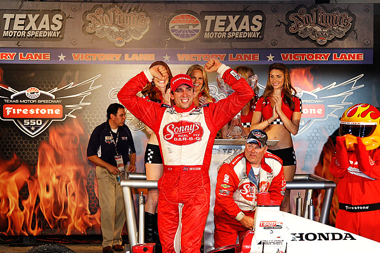 IZOD IndyCar Series Firestone 500 Justin Wilson, driver of the #18 Dale Coyne Sonny's BBQ Dallara Honda, celebrates in Victory Lane after winning the Izod IndyCar Series Firestone 550 at Texas Motor Speedway. (Chris Graythen/Getty Images)