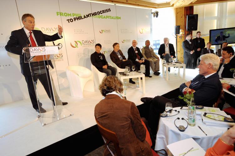 Former British Prime Minister Tony Blair speaks as former US President Bill Clinton (R) listens in Davos on January 29, 2009 during the Davos Philanthropic Roundtable. Other participants present are Chinese movie star Jet Li, Bill Gates, Bangladeshi banker and 2006 Nobel peace prize laureate Muhammad Yunus and Richard Branson. More than 2500 heads of states and government, ministers, captains of industry and leaders of churches and pressure groups were also present at the World Economic Forum. (Fabrice Coffrini/AFP/Getty Images) Former British Prime Minister Tony Blair speaks as former US President Bill Clinton (R) listens in Davos on January 29, 2009 during the Davos Philanthropic Roundtable. Other participants present are Chinese movie star Jet Li, Bill Gates, Bangladeshi banker and 2006 Nobel peace prize laureate Muhammad Yunus and Richard Branson. More than 2500 heads of states and government, ministers, captains of industry and leaders of churches and pressure groups were also present at the World Economic Forum. (Fabrice Coffrini/AFP/Getty Images)