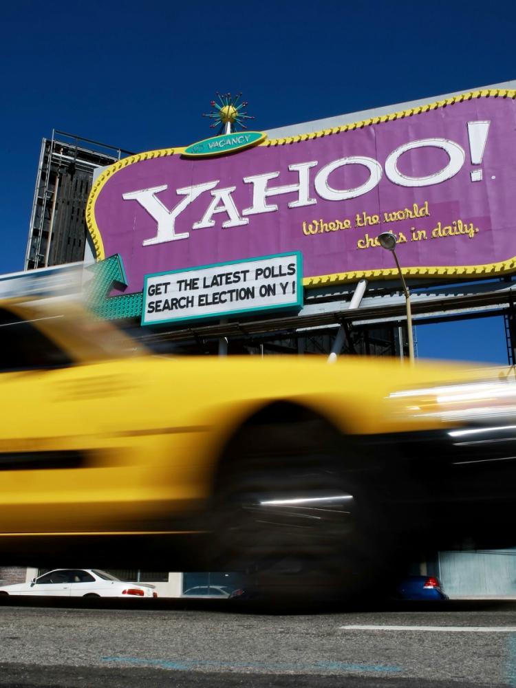 TAKEOVER TARGET? A taxicab drives by a Yahoo billboard in San Francisco, Calif. Yahoo is involved in speculation that the company may be a target for corporate takeover. (Justin Sullivan/Getty Images) TAKEOVER TARGET? A taxicab drives by a Yahoo billboard in San Francisco, Calif. Yahoo is involved in speculation that the company may be a target for corporate takeover. (Justin Sullivan/Getty Images)