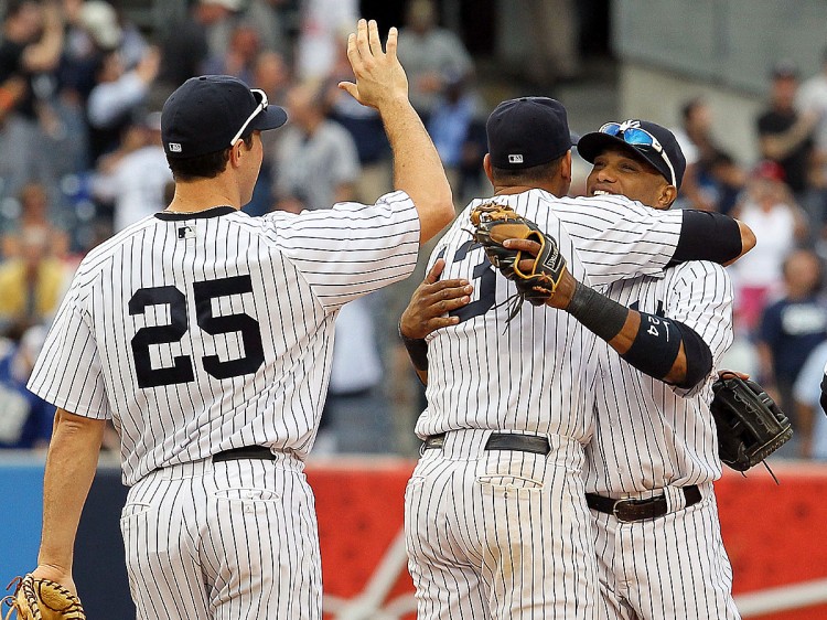 Yankee teammates Mark Teixera, Alex Rodriguez, and Robinson Cano celebrate another postseason berth with their Wednesday afternoon win over Tampa Bay. Since the baseball's expansion to the current eight-team format in 1995 they've missed the fall classic just once. (Jim McIsaac/Getty Images) Yankee teammates Mark Teixera, Alex Rodriguez, and Robinson Cano celebrate another postseason berth with their Wednesday afternoon win over Tampa Bay. Since the baseball's expansion to the current eight-team format in 1995 they've missed the fall classic just once. (Jim McIsaac/Getty Images)