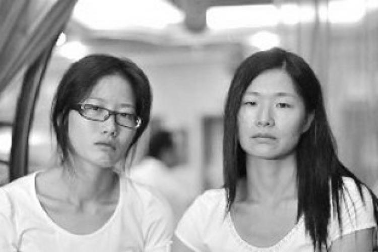 Zhong Rujiu (left) and her sister, Zhong Rucui, are still in shock after seeking refuge in an airport restroom on Sept. 16. (Courtesy of a Chinese blogger) Zhong Rujiu (left) and her sister, Zhong Rucui, are still in shock after seeking refuge in an airport restroom on Sept. 16. (Courtesy of a Chinese blogger)
