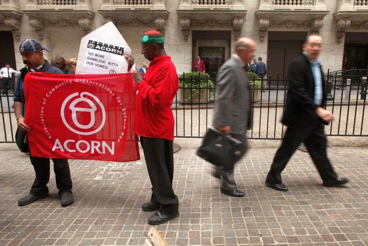Businessmen walk by members of the activist housing group ACORN protest in front of Wall St.on June 16, 2009 in New York City. The House of Representatives on Thursday voted to eliminate federal funding of ACORN. (Spencer Platt/Getty Images) Businessmen walk by members of the activist housing group ACORN protest in front of Wall St.on June 16, 2009 in New York City. The House of Representatives on Thursday voted to eliminate federal funding of ACORN. (Spencer Platt/Getty Images)