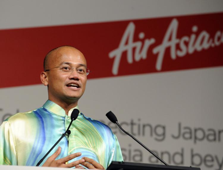 LOW COST CHALLENGE: Malaysia based low cost air carrier AirAsia X CEO Azran Osman Rani makes a pricing announcement during a press conference at a Tokyo hotel this past September. Rani is using creative ways to make his airline stand out from other low cost airlines. (Yoshikazu Tsuno/Getty Images) LOW COST CHALLENGE: Malaysia based low cost air carrier AirAsia X CEO Azran Osman Rani makes a pricing announcement during a press conference at a Tokyo hotel this past September. Rani is using creative ways to make his airline stand out from other low cost airlines. (Yoshikazu Tsuno/Getty Images)
