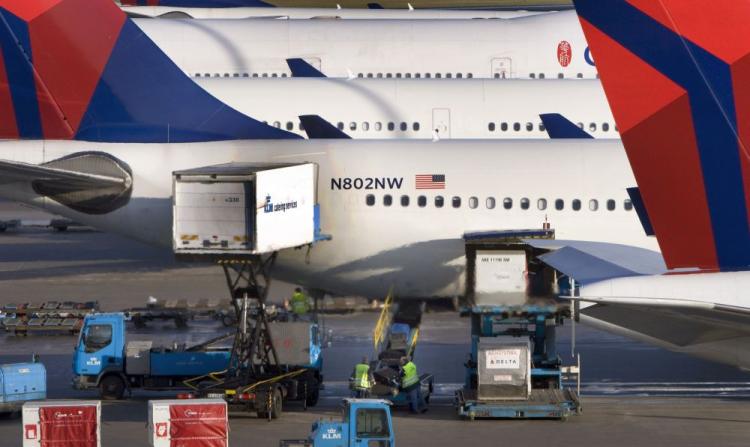 Aircraft from Delta-Northwest are being supplied and loaded before departure at Schiphol Airport, near Amsterdam on December 26, 2009. The United States has asked airlines worldwide to tighten security after a Nigerian tried to blow up a U.S. airliner he boarded in Amsterdam, Dutch authorities said today. (Marcel Antonisse/AFP/Getty Images)