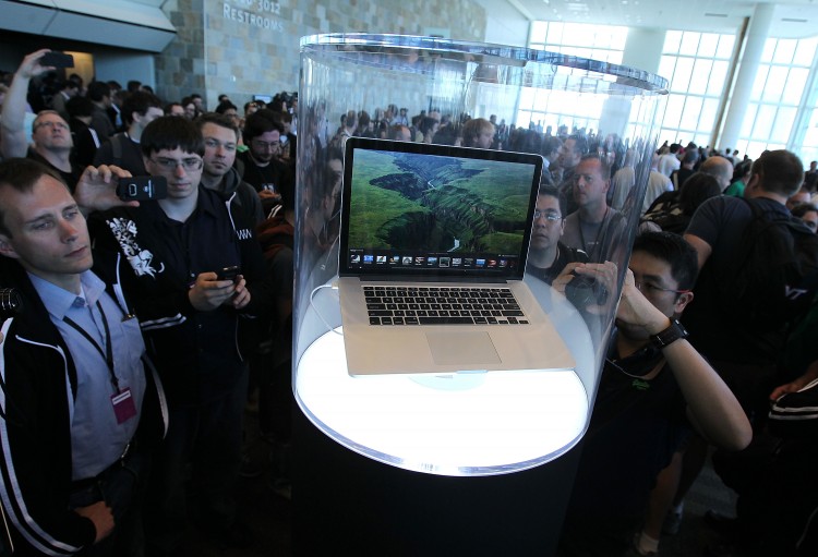 Attendees at Apple's WWDC conference look at the newly launched Retina MacBook Pro on June 11, in San Francisco, Calif. (Justin Sullivan/Getty Images) Attendees at Apple's WWDC conference look at the newly launched Retina MacBook Pro on June 11, in San Francisco, Calif. (Justin Sullivan/Getty Images)
