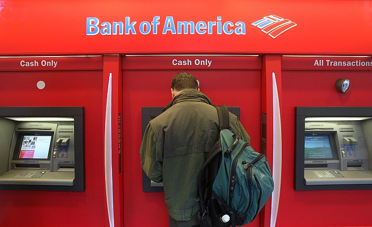 man standing in a Bank of America AT
