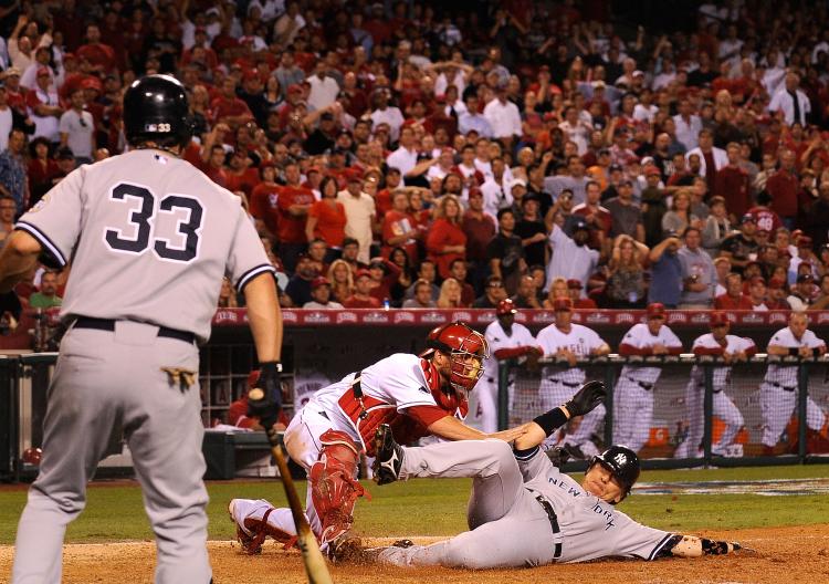 Hideki Matsui #55 of the New York Yankees slides into home base safe ahead of Jeff Mathis #5 of the Los Angeles Angels of Anaheim tag during the seventh inning in Game Five of the ALCS during the 2009 MLB Playoffs at Angel Stadium on October 22, 2009 in A (Kevork Djansezian/Getty Images) Hideki Matsui #55 of the New York Yankees slides into home base safe ahead of Jeff Mathis #5 of the Los Angeles Angels of Anaheim tag during the seventh inning in Game Five of the ALCS during the 2009 MLB Playoffs at Angel Stadium on October 22, 2009 in A (Kevork Djansezian/Getty Images)
