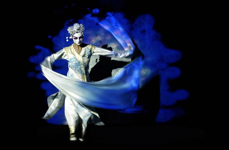 A dancer performs during a press rehearsal of Canadian author, director and actor Robert Lepage's creation 'The Blue Dragon.' (Alain Julien/AFP/Getty Images) A dancer performs during a press rehearsal of Canadian author, director and actor Robert Lepage's creation 'The Blue Dragon.' (Alain Julien/AFP/Getty Images)