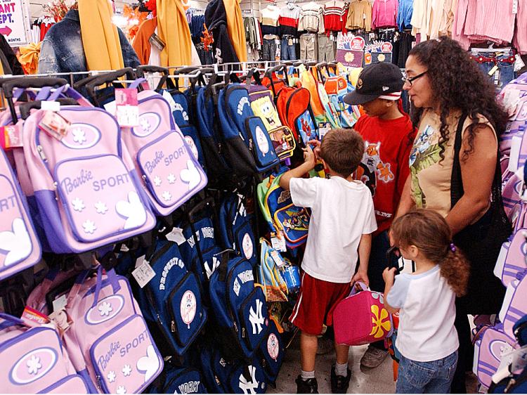 The Benevides family shops for school bags and back to school clothes at Cookies in the Brooklyn borough of New York City. (Stephen Chernin/Getty Images ) The Benevides family shops for school bags and back to school clothes at Cookies in the Brooklyn borough of New York City. (Stephen Chernin/Getty Images )