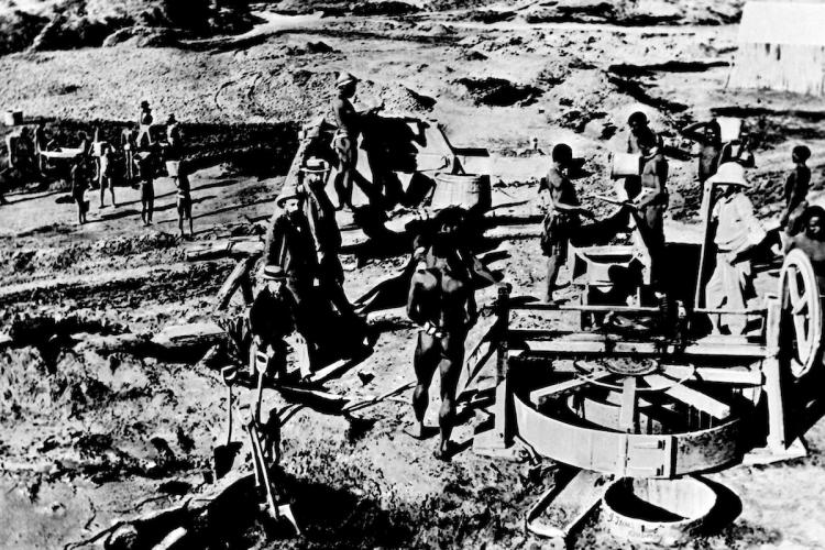 The early days of the Kimberley mine in 1871 in Kimberley, South Africa. The image shows the first mining machines, and the exploitation of the local black population. (De Beers via Patrick Landmann/Getty Images) The early days of the Kimberley mine in 1871 in Kimberley, South Africa. The image shows the first mining machines, and the exploitation of the local black population. (De Beers via Patrick Landmann/Getty Images)