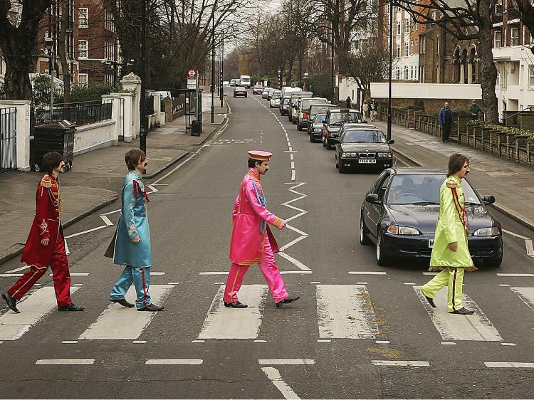 Actors dressed as the Beatles crossing the zebra crossing outside the Abbey Road Studios in London. (Peter Macdiarmid/Getty Images) Actors dressed as the Beatles crossing the zebra crossing outside the Abbey Road Studios in London. (Peter Macdiarmid/Getty Images)