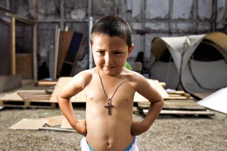 A young Roma boy stands in makeshift camp in Saint-Denis, outside Paris on Aug. 7. French President Nicolas Sarkozy began Thursday dismantling 300 camps of migrant and travelling peoples. (Joel Saget/AFP/Getty Images) A young Roma boy stands in makeshift camp in Saint-Denis, outside Paris on Aug. 7. French President Nicolas Sarkozy began Thursday dismantling 300 camps of migrant and travelling peoples. (Joel Saget/AFP/Getty Images)