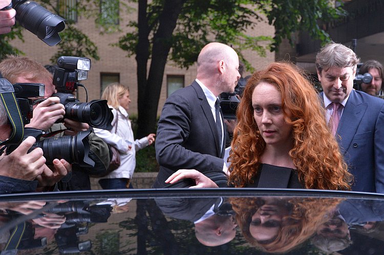 Rebekah Brooks, (2nd R) former chief executive of News International, and her husband Charlie Brooks (R) leave Southwark Crown Court in London, on June 22, after a preliminary hearing in which both face charges of conspiracy to pervert the course of justice in relation to the phone hacking scandal. (Carl Court/AFP/GettyImages) Rebekah Brooks, (2nd R) former chief executive of News International, and her husband Charlie Brooks (R) leave Southwark Crown Court in London, on June 22, after a preliminary hearing in which both face charges of conspiracy to pervert the course of justice in relation to the phone hacking scandal. (Carl Court/AFP/GettyImages)