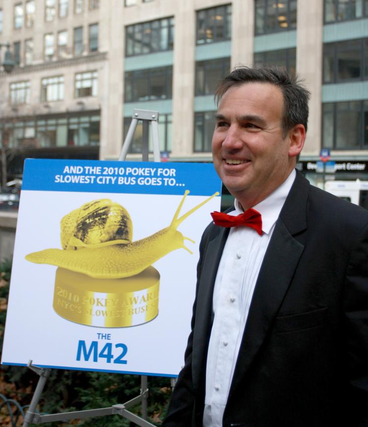 AND THE WINNER IS: Gene Russianoff declares the M42 bus the slowest, or 'pokiest' bus in the city at the 'Pokey and Schleppie' award ceremonies. (Tara MacIsaac/The Epoch Times) AND THE WINNER IS: Gene Russianoff declares the M42 bus the slowest, or 'pokiest' bus in the city at the 'Pokey and Schleppie' award ceremonies. (Tara MacIsaac/The Epoch Times)