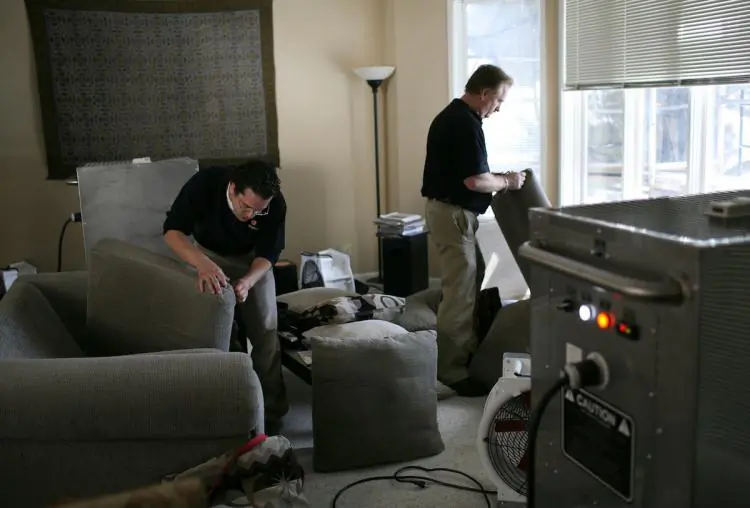 Exterminators inspecting a house for bed bugs in an undated photo. (Justin Sullivan/Getty Images)