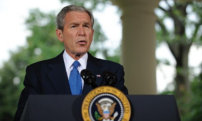 Then-President George W. Bush delivers a speech from the porch of the Oval Office at the White House in Washington on July 31, 2008. (Shawn Thew/Getty Images)