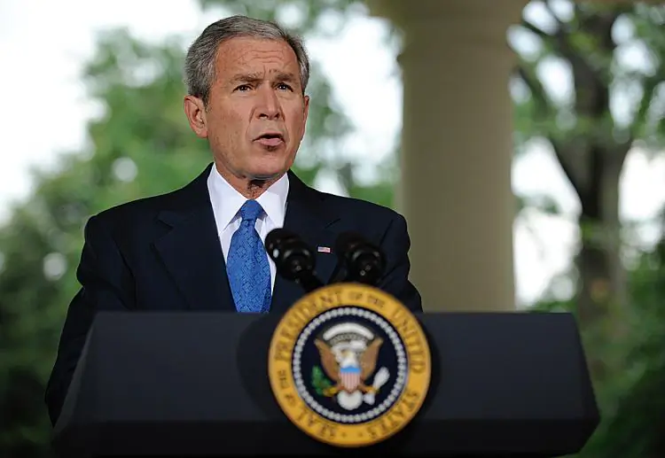 Then-President George W. Bush delivers a speech from the porch of the Oval Office at the White House in Washington on July 31, 2008. (Shawn Thew/Getty Images)