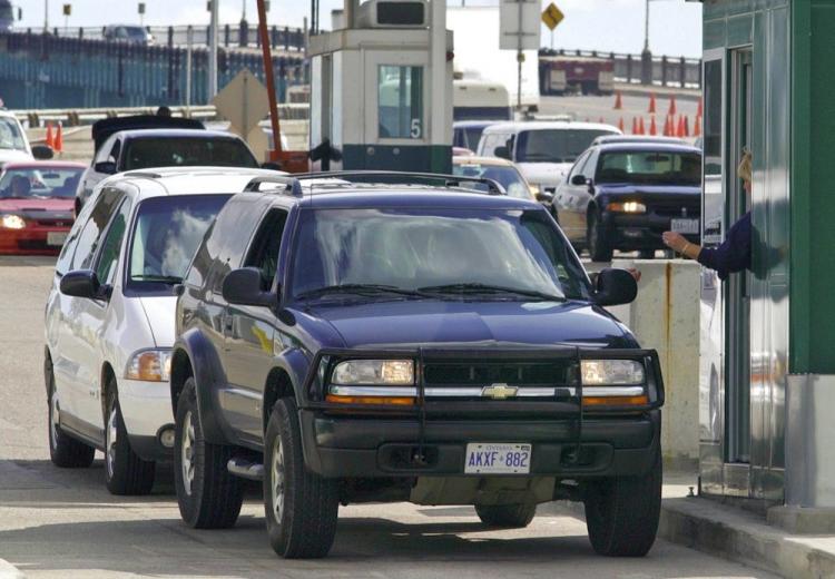 Vehicles stop at a border checkpoint in Detroit after crossing the Ambassador Bridge, which connects Detroit, Mich., and Windsor, Ontario. With layers of new regulations and inspections often leading to long wait times, the Canadian Chamber of Commerce is calling for improved border efficiency between Canada and the United States. (Jeff Kowalsky/AFP/Getty Images) Vehicles stop at a border checkpoint in Detroit after crossing the Ambassador Bridge, which connects Detroit, Mich., and Windsor, Ontario. With layers of new regulations and inspections often leading to long wait times, the Canadian Chamber of Commerce is calling for improved border efficiency between Canada and the United States. (Jeff Kowalsky/AFP/Getty Images)