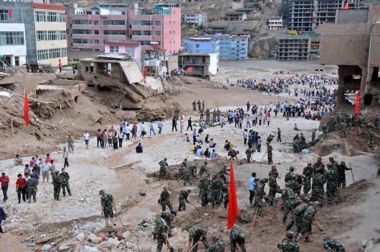 Chinese rescuers search for survivors in Zhouqu, in northwest China's Gansu province on August 8, after a deadly flood-triggered landslide. At least 127 people were killed and nearly 2,000 missing.  (STR/Getty Images)