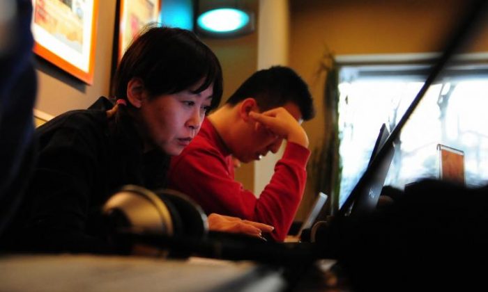 According to the 2007 Annual Report on China's Internet Network, the struggle for free online access by everyday Chinese Internet users is getting more desperate as the Chinese Communist regime has stepped up on its control on the Internet. (Frederic J. Brown/AFP/Getty Images)