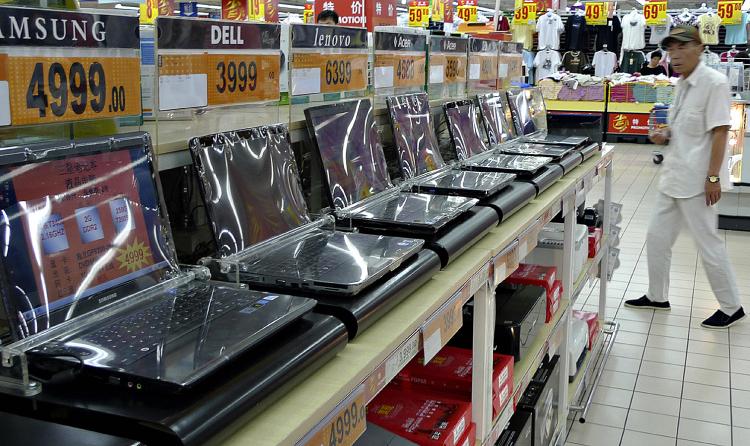 A man walks next to a row of laptops displayed at a supermarket in Beijing, June 10, 2009. (Liu Jin/AFP/Getty Images) A man walks next to a row of laptops displayed at a supermarket in Beijing, June 10, 2009. (Liu Jin/AFP/Getty Images)