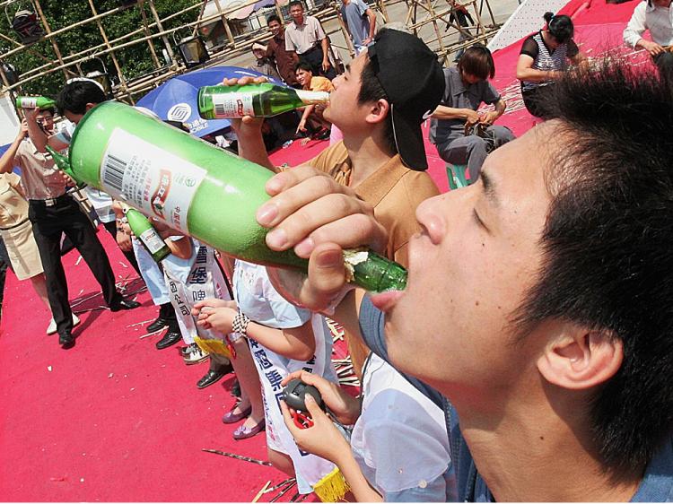 Chinese youth takes part in a beer drinking competition in Nanjing of Guangxi Autonomous Region, China. (China Photos/Getty Images) Chinese youth takes part in a beer drinking competition in Nanjing of Guangxi Autonomous Region, China. (China Photos/Getty Images)