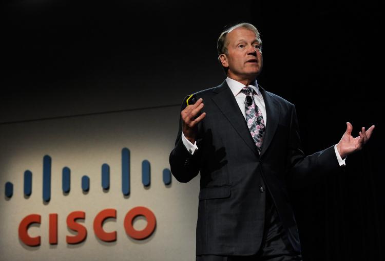 Cisco Systems chairman and CEO John Chambers speaks during a press event at the 2010 International Consumer Electronics Show Jan 6, 2010 in Las Vegas, Nevada. Cisco announced the CRS-3, a carrier-grade router capable of handling 322 Tbps of data traffic. (Ethan Miller/Getty Images) Cisco Systems chairman and CEO John Chambers speaks during a press event at the 2010 International Consumer Electronics Show Jan 6, 2010 in Las Vegas, Nevada. Cisco announced the CRS-3, a carrier-grade router capable of handling 322 Tbps of data traffic. (Ethan Miller/Getty Images)
