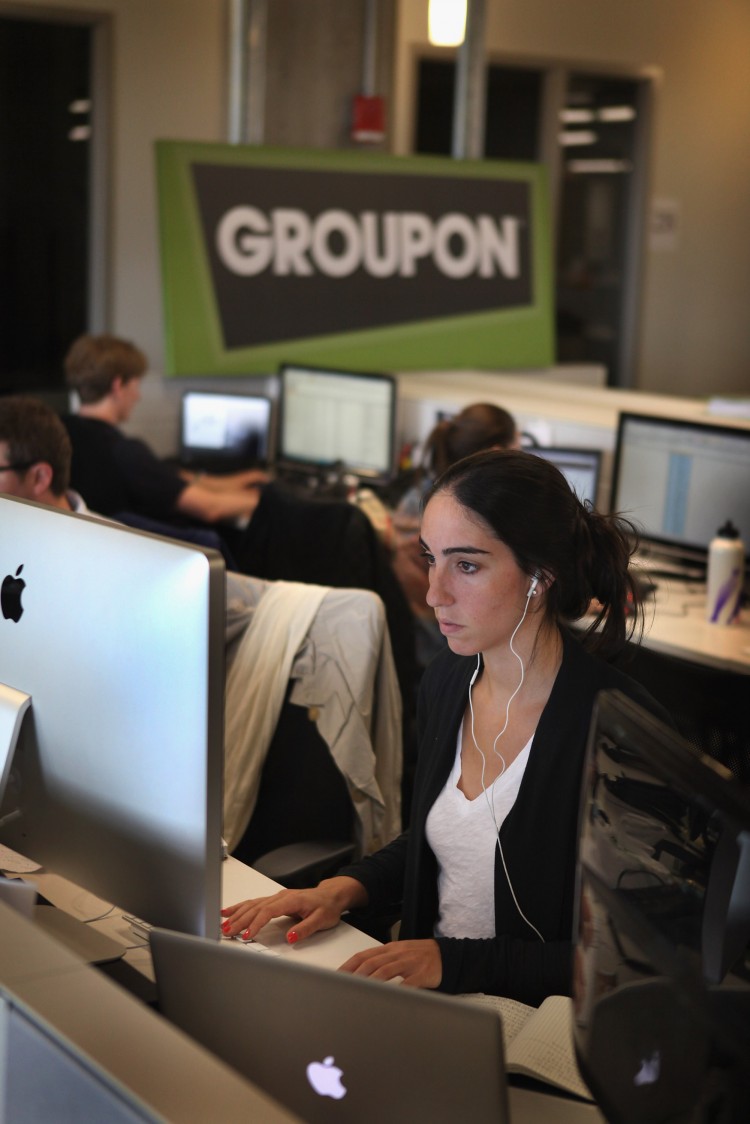NEXT IN LINE: Workers work on projects at Groupons international headquarters on June 10 in Chicago. (Scott Olson/Getty Images)