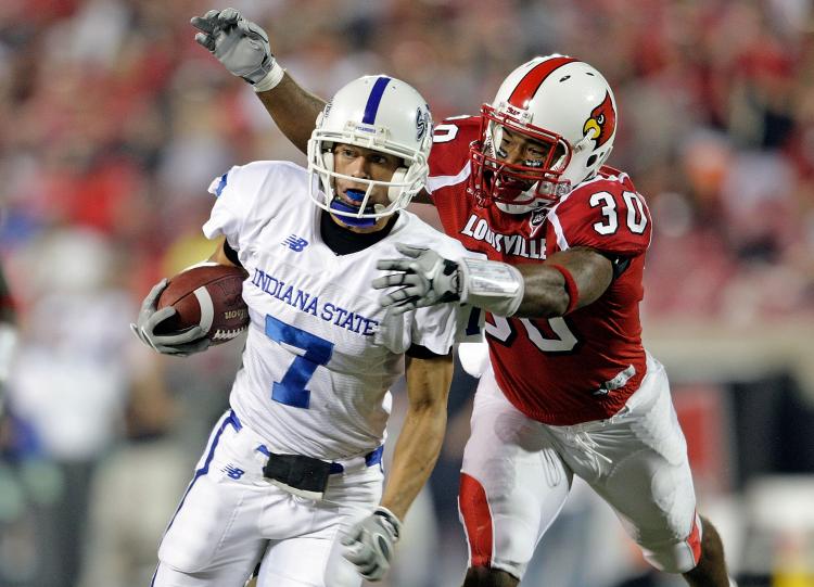 Daniel Covington, # 30 pictured above making the tackle, was shot and killed in Louisville on Thursday. (Andy Lyons/Getty Images) Daniel Covington, # 30 pictured above making the tackle, was shot and killed in Louisville on Thursday. (Andy Lyons/Getty Images)