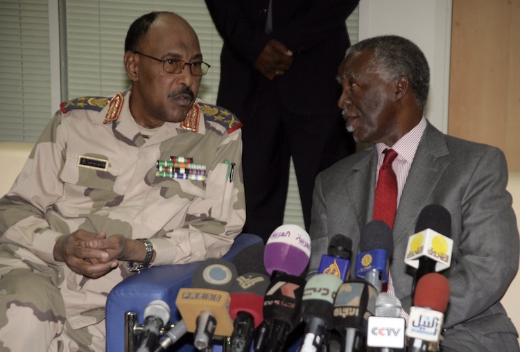 Sudanese Defense Minister Abdel Rahim Mohamed Hussein (L) and chief African Union mediator and former South African president Thabo Mbeki (R) speak prior to their press conference about the release of the UN deminers on May 20, 2012. (Ashraf Shazly/AFP/GettyImages) Epoch Times Photo
