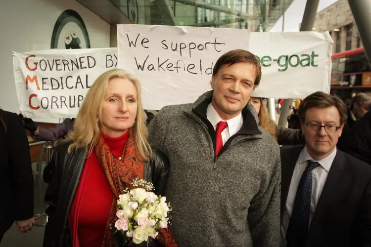 Dr Andrew Wakefield walks with his wife Carmel after speaking to reporters at the General Medical Council on Jan. 28, in London, England. (Peter Macdiarmid/Getty Images)