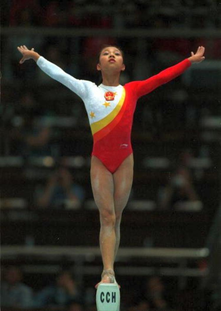 Fangxiao Dong of China performs her balance beam routine during the womens teams final at the 1999 Tianjin World Gymnastics Championships, Tianjin, China. China finished third. (Jack Atley/ALLSPORT) Fangxiao Dong of China performs her balance beam routine during the womens teams final at the 1999 Tianjin World Gymnastics Championships, Tianjin, China. China finished third. (Jack Atley/ALLSPORT)