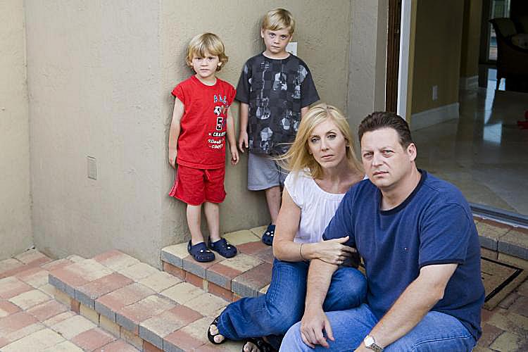 The Willis family, (R-L) John, wife Lori, and their children, Brannon, 5, and Alex, 3 Â½, outside their Parkland, Florida, home built with Chinese-made drywall. (Yelena Bleiman)