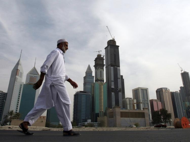 A man walks at the construction site of Dubai's Business Bay in the Gulf emirate on November 29, 2009. (Karim Sahib/AFP/Getty Images) A man walks at the construction site of Dubai's Business Bay in the Gulf emirate on November 29, 2009. (Karim Sahib/AFP/Getty Images)