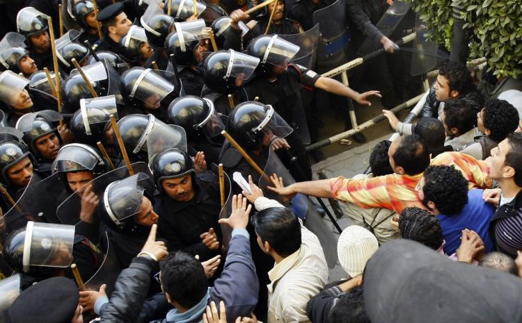 Egyptian demonstrators demanding the ouster of President Hosni Mubarak and calling for reforms face riot police in Cairo on January 26, 2011. (Mohammed Abed/AFP/Getty Images) Egyptian demonstrators demanding the ouster of President Hosni Mubarak and calling for reforms face riot police in Cairo on January 26, 2011. (Mohammed Abed/AFP/Getty Images)