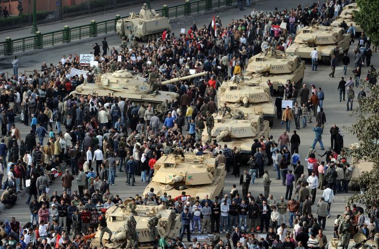 A column of Abrams tanks line the street as Egyptian demonstrators gather in Tahrir Square in Cairo, on Jan. 30, the sixth day of protests against Hosni Mubarak's regime. (Miguel Medina/AFP/Getty Images) A column of Abrams tanks line the street as Egyptian demonstrators gather in Tahrir Square in Cairo, on Jan. 30, the sixth day of protests against Hosni Mubarak's regime. (Miguel Medina/AFP/Getty Images)