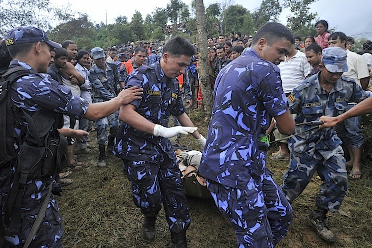 Nepalese police recover the body of a passenger who died when a Buddha Air Beechcraft 1900D aircraft crashed at Kot Danda in Lalitpur, on the outskirts of Kathmandu, on September 25. (Prakesh Mathema/AFP/Getty Images) Nepalese police recover the body of a passenger who died when a Buddha Air Beechcraft 1900D aircraft crashed at Kot Danda in Lalitpur, on the outskirts of Kathmandu, on September 25. (Prakesh Mathema/AFP/Getty Images)