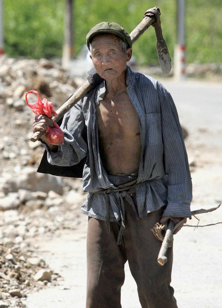 An elderly Chinese farmer in the outskirts of Beijing, 2007. (STR/AFP/Getty Images) An elderly Chinese farmer in the outskirts of Beijing, 2007. (STR/AFP/Getty Images)