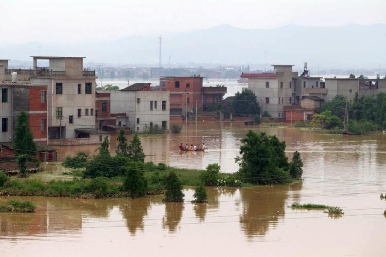 Chinese villagers leave their flooded homes in Fuzhou, east China's Jiangxi province on June 23, 2010. (STR/AFP/Getty Images) Chinese villagers leave their flooded homes in Fuzhou, east China's Jiangxi province on June 23, 2010. (STR/AFP/Getty Images)