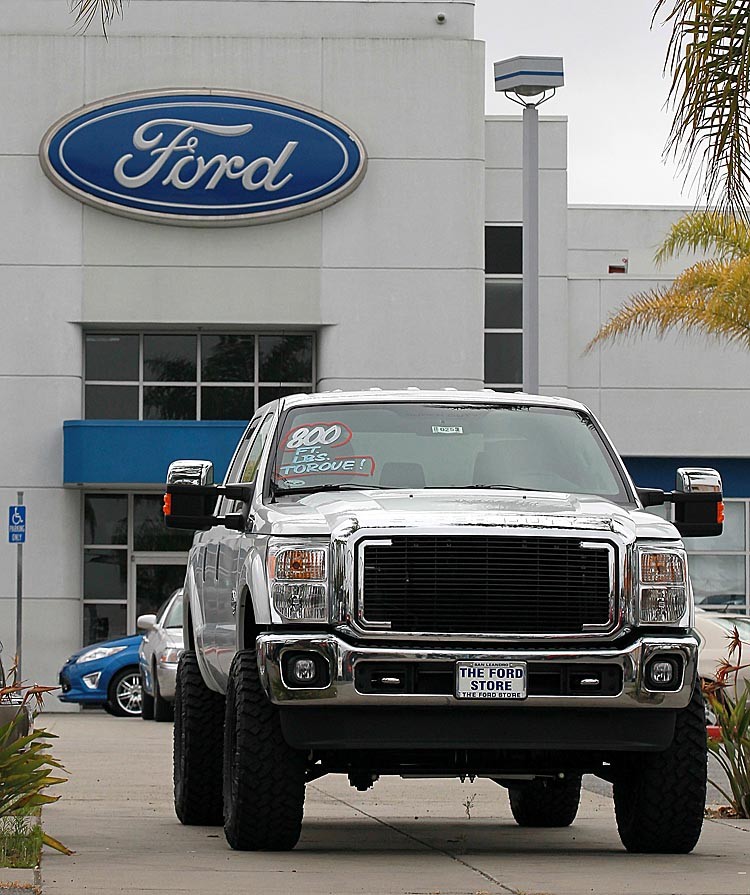 PROFITABLE: A new Ford truck is displayed on the sales lot at The Ford Store on July 26, in San Leandro, Calif. Ford Motor Company reported its ninth consecutive quarterly profit with second-quarter earnings of $2.4 billion or 59 cents a share compared to $2.6 billion, or 61 cents a share one year ago. (Justin Sullivan/Getty Images) PROFITABLE: A new Ford truck is displayed on the sales lot at The Ford Store on July 26, in San Leandro, Calif. Ford Motor Company reported its ninth consecutive quarterly profit with second-quarter earnings of $2.4 billion or 59 cents a share compared to $2.6 billion, or 61 cents a share one year ago. (Justin Sullivan/Getty Images)