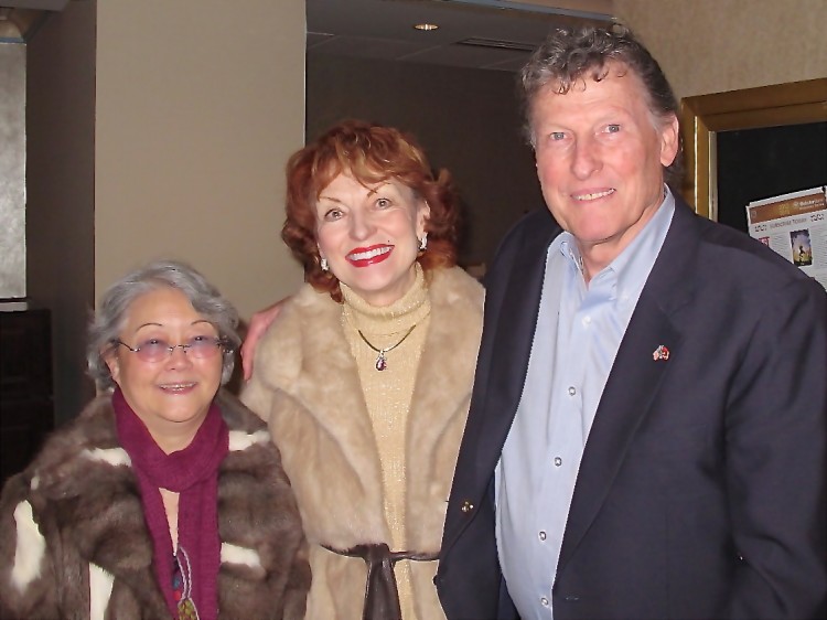 former dancer Patulla Comstock (C) with her husband, Charles, and her friend attend Shen Yun