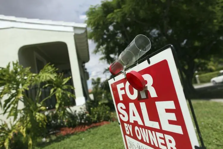 A "for sale" sign is displayed outside a home in Miami, in this file photo. (Joe Raedle/Getty Images)