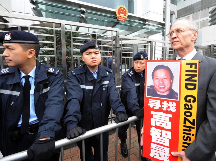 Solicitor John Clancey (R), a member of a lawyers concern group protests for the release of Beijing human rights lawyer Gao Zhisheng outside the China Liaison office in Hong Kong on February 4, 2010. Gao was taken from his home on February 4, 2009 and his whereabouts are still unkown. (Mike Clarke/AFP/Getty Images) Solicitor John Clancey (R), a member of a lawyers concern group protests for the release of Beijing human rights lawyer Gao Zhisheng outside the China Liaison office in Hong Kong on February 4, 2010. Gao was taken from his home on February 4, 2009 and his whereabouts are still unkown. (Mike Clarke/AFP/Getty Images)