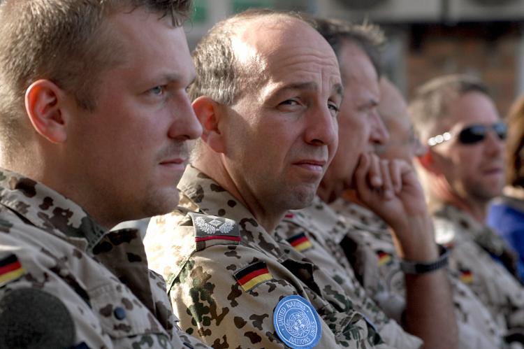 German soldiers from the International Security Assistance Force (ISAF) listen to speeches during a ceremony on June 17, 2007, to pass a police training program to the European Mission in Kabul, Afghanistan. (Shah Marai/AFP/Getty Images)