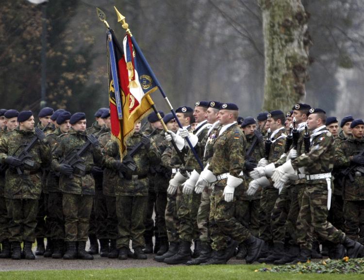 COOPERATIVE SERVICE: German and French troops parade during a ceremony in the eastern French city of Strasbourg on Dec. 10, to mark the deployment of the first German combat unit to be stationed in France since the end of World War II. (Christian Lutz/AFP/Getty Images) COOPERATIVE SERVICE: German and French troops parade during a ceremony in the eastern French city of Strasbourg on Dec. 10, to mark the deployment of the first German combat unit to be stationed in France since the end of World War II. (Christian Lutz/AFP/Getty Images)