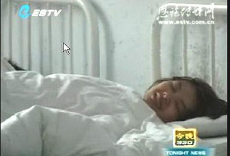 Deng Yujiao, when she was locked in a psychiatric hospital. (Screen grab from Enshi City TV/The Epoch Times) Deng Yujiao, when she was locked in a psychiatric hospital. (Screen grab from Enshi City TV/The Epoch Times)