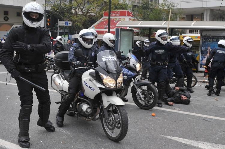Police detains a demonstrator in central Athens on December 6, 2009 during a massive demonstration commemorating 15-year-old Alexandros Grigoropoulos' fatal shooting a year ago. (Louisa Gouliamaki/AFP/Getty Images)