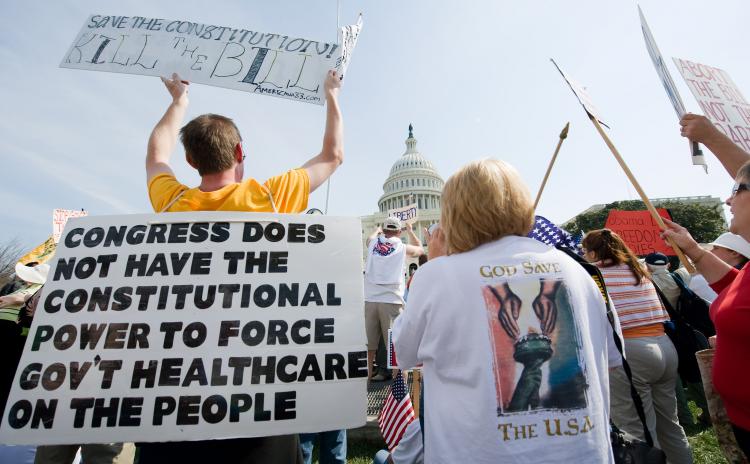 Health care reform: Supporters of the Tea Party movement demonstrate outside the US Capitol in Washington in March 2010 against the health care bill. A Florida judge ruled the health care law unconstitutional on Monday. (NICHOLAS KAMM/AFP/Getty Images) Health care reform: Supporters of the Tea Party movement demonstrate outside the US Capitol in Washington in March 2010 against the health care bill. A Florida judge ruled the health care law unconstitutional on Monday. (NICHOLAS KAMM/AFP/Getty Images)